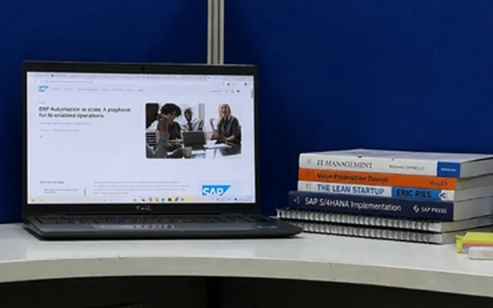 Live online SAP training on a laptop showing a real SAP screen