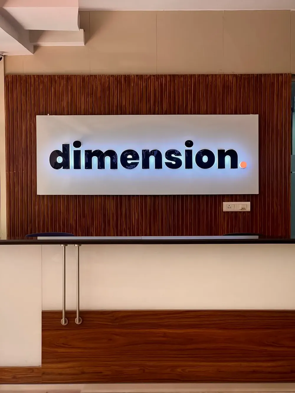 Dimension reception signage inside the Baner, Pune training centre
