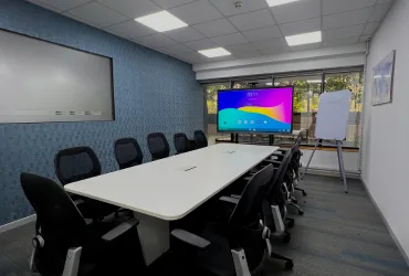 High-tech conference room at Dimension SAP Training featuring an interactive smart display and long boardroom table