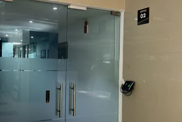 Secured glass main entrance door with biometric scanner at Dimension SAP Training center.
