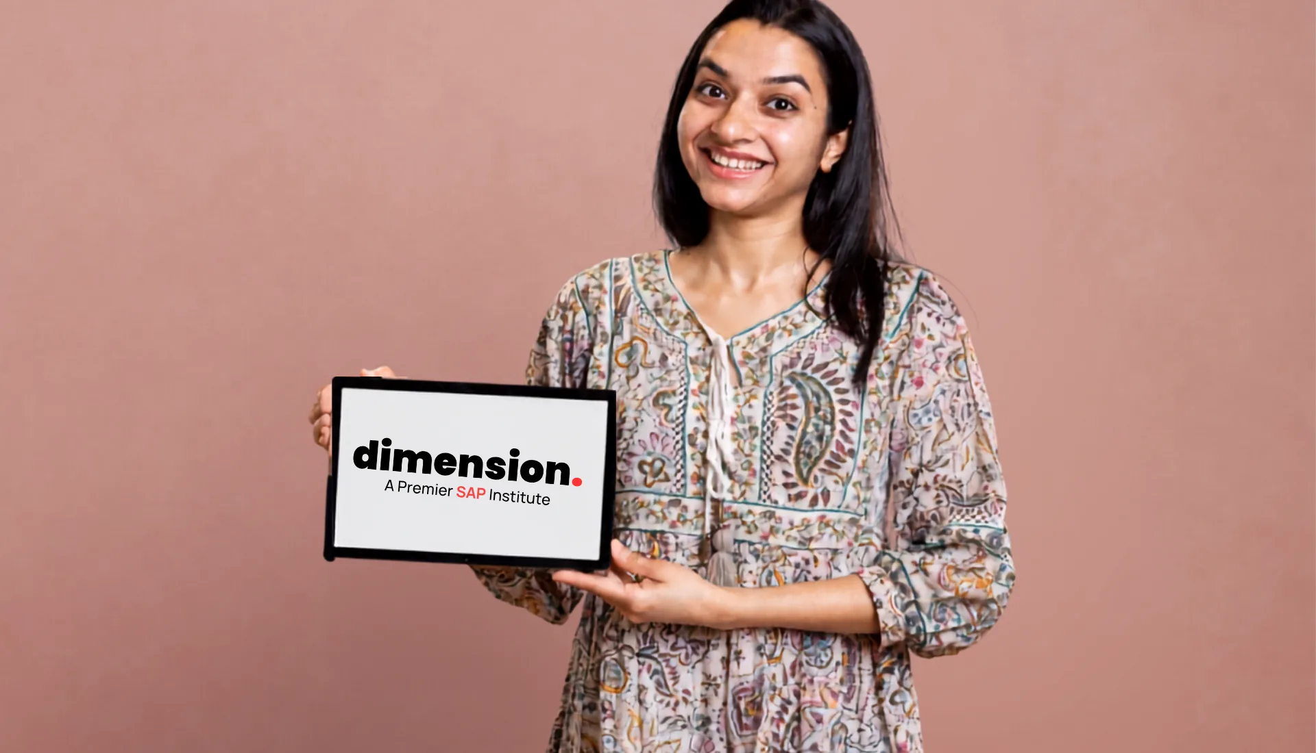 Smiling professional showcasing a tablet with Dimension A Premier SAP Institute branding