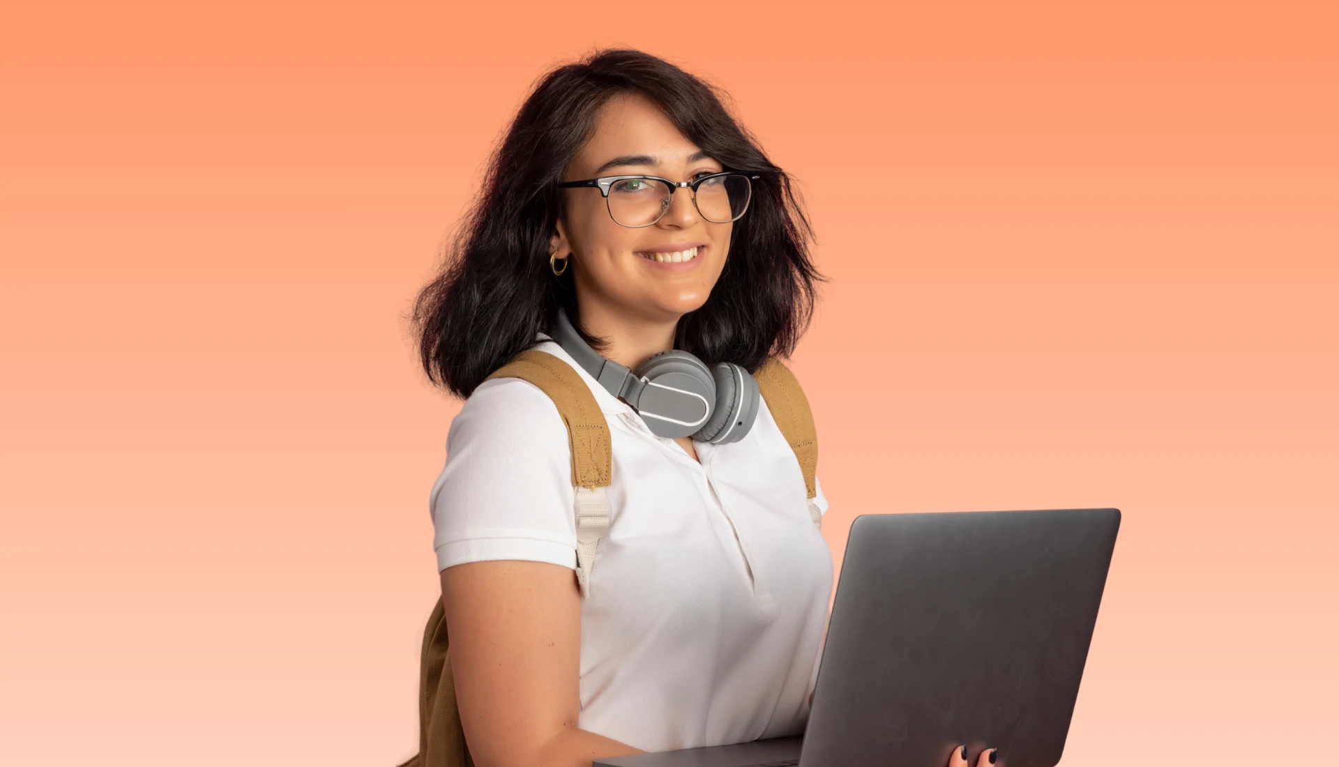 A young student holding a laptop for consultation regarding SAP training at Dimension's training center